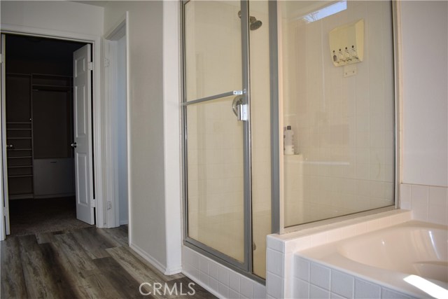 master bath with walk in closet. new flooring