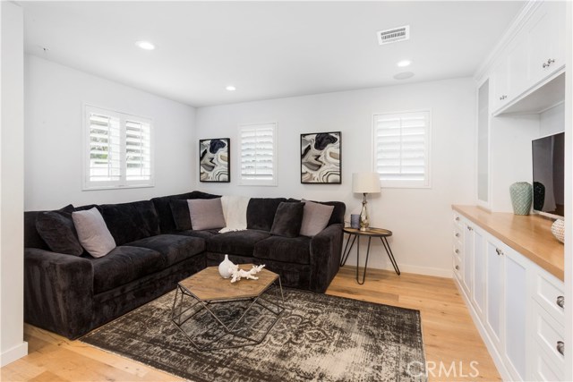 FAMILY ROOM W/ BUILT IN CABINETS, SPEAKERS, MEDIA READY
