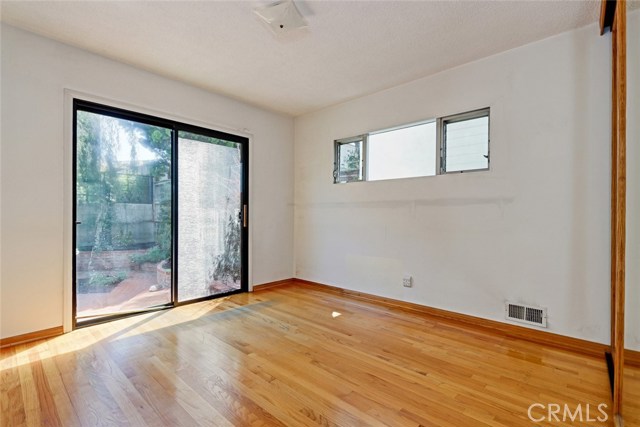 East side bedroom opens to a back yard area.. imagine how you might utilize the area.
