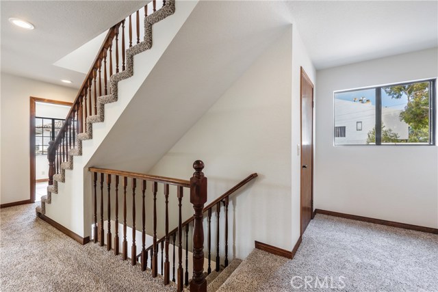 Main level landing, stairwells down to entry and up to 3rd floor