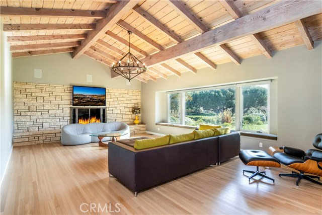 The living room overlooks the front yard and offers ocean views into Lunada Bay.