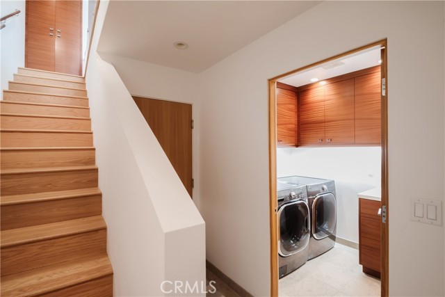 Lower level features a private laundry room with sink and storage along with the 4th bedroom and garage access.