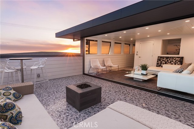 Top floor entertainment room & outdoor deck with firepit