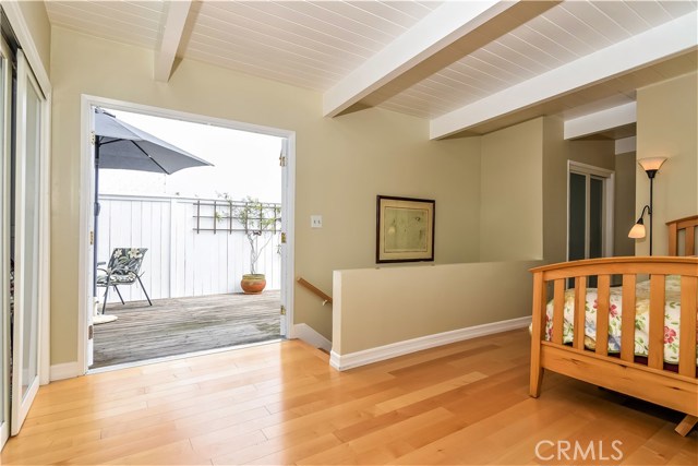 The master bedroom has a very large private deck through the double doors at the top of the stairway.