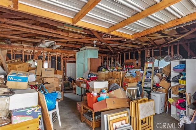 Look at all the storage!! Oversized 2 car garage is 28' deep and 23' wide. The additional depth is framed and could be a nice office or workshop. You can see the framed wall. Door is to backside of garage.