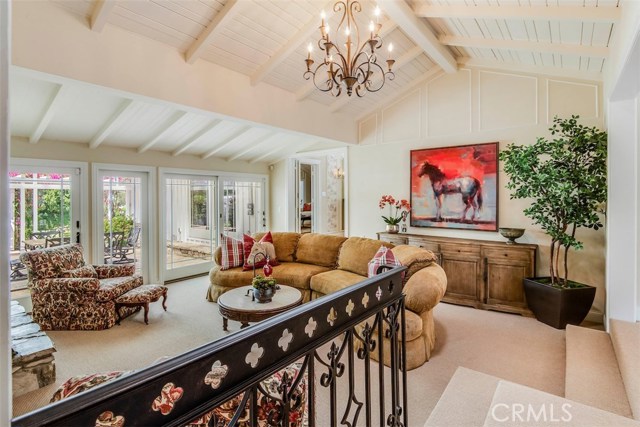 Family room of fthe kitchen with high ceilings and many patio doors for lots of natural light.