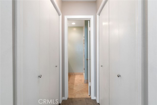 Closets on each side as you enter the bath.