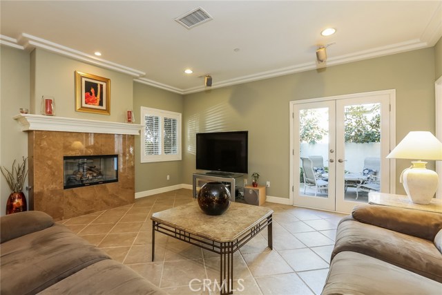 Family room w/fireplace and French doors to private back yard