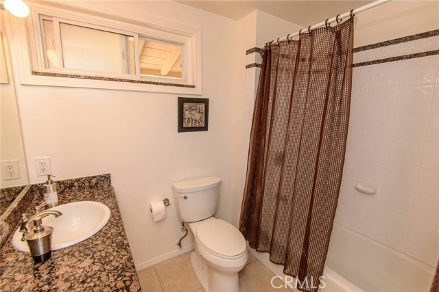 Updated bathroom with tub.