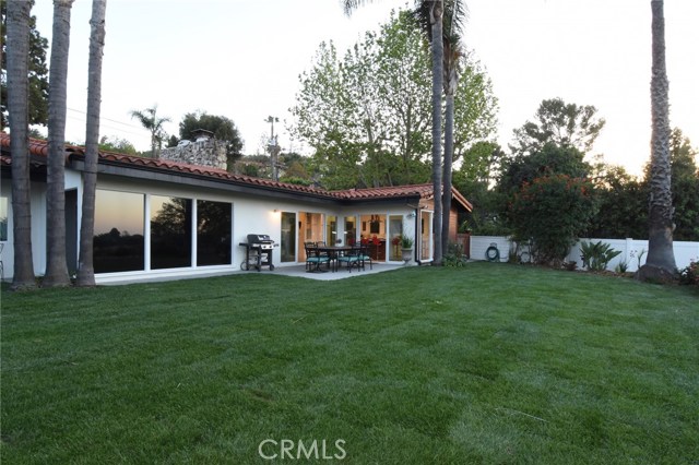 Another view of this beautifu, tranquil home from the back yard.  Home has pretty tile roof, too!