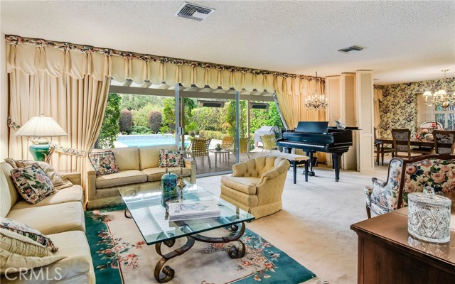 Living room/dining room overlooking backyard