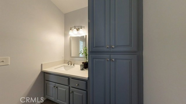 Nicely updated downstairs guest bathroom with beautiful lighting and fixtures conveniently adjacent to the family room and kitchen area.