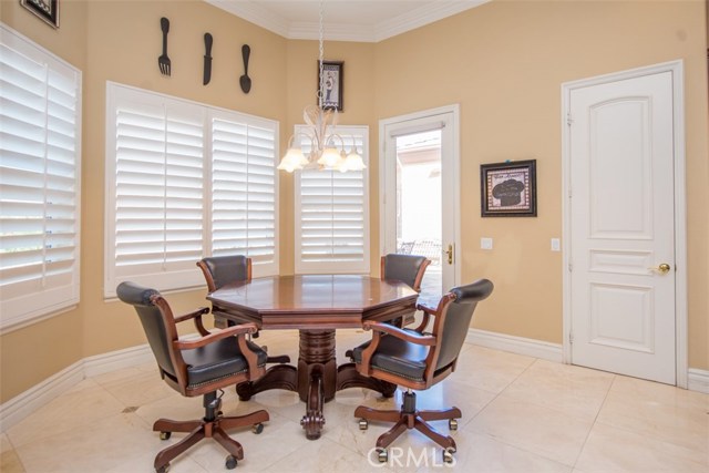 Eat-in Kitchen area with Plantation Shutters.