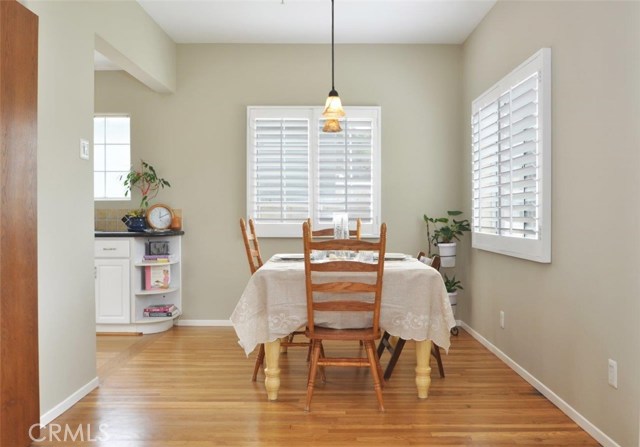 Light and airy dining room is adjacent to the kitchen