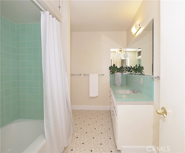 Hall bathroom with tub.