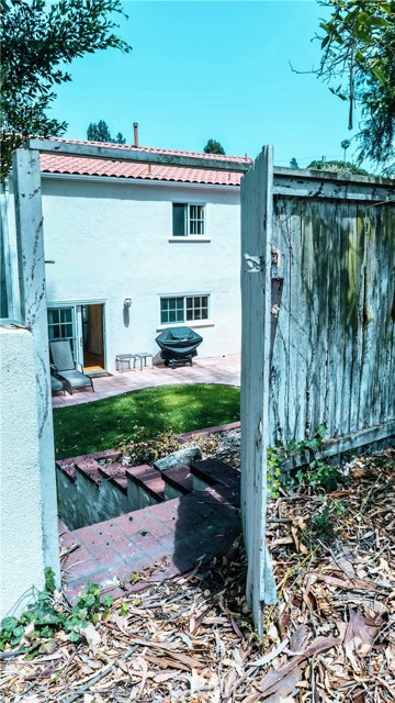 Private entrance to rustic path behind the property