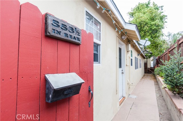 Main house is 553 1/2 all the way back.  nice garden area and new fence on east side of property.