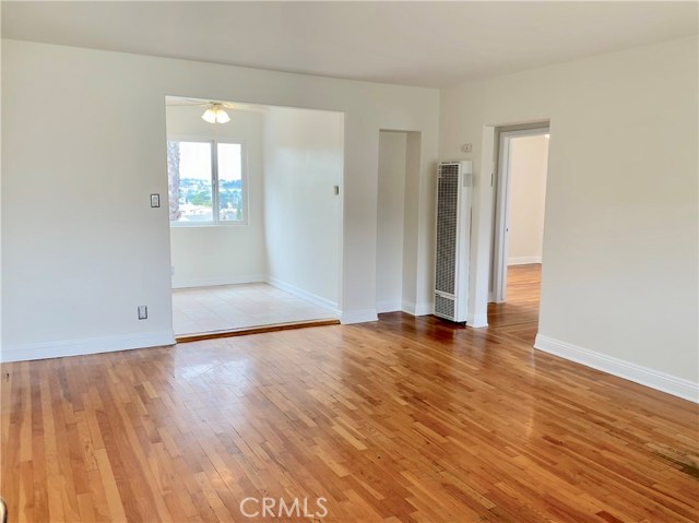 Entry into living room. View through kitchen dining area.