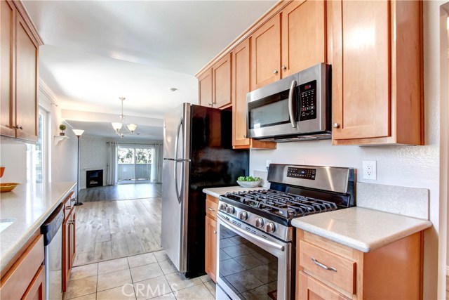 UPDATED KITCHEN, NEWER GAS STOVE AND REFRIGERATOR, CORIAN COUNTERS AND BEAUTIFUL WOOD CABINTRY UPDATED KITCHEN, NEWER GAS STOVE AND REFRIGERATOR, CORIAN COUNTERS AND BEAUTIFUL WOOD CABINTRY