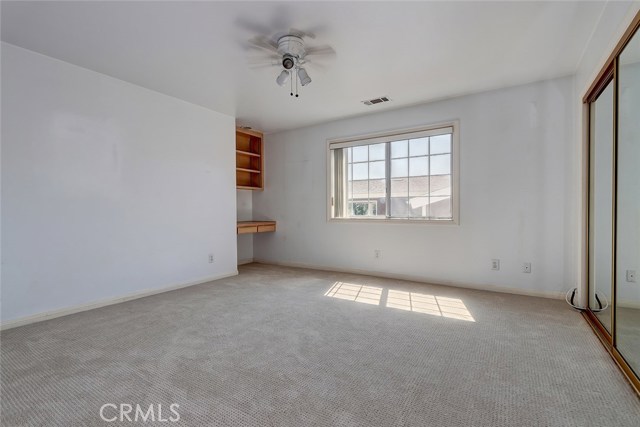 Second Floor Bedroom with Built-In Desk and Shelving