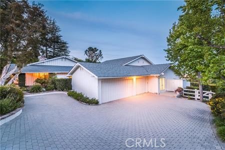 Spacious driveway provides plenty of parking, plus 3 car garage.