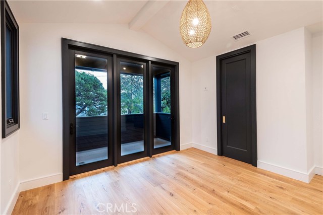 North East bedroom #1, 12'x12' with EnSuite Bathroom, East facing private patio overlooking the trees on Pine Avenue. Patio flooring is Porcelain.