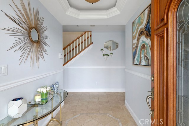 Inviting foyer with bedrooms to each side