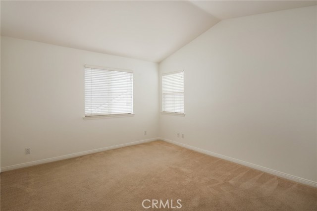 Master bedroom with vaulted ceiling