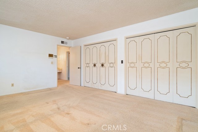 Master bedroom is quite large (18 x 15) and has a 16' closet. The closet is one continuous open space.
