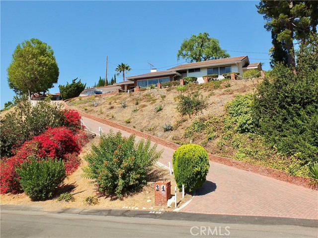 Perched high on a hillside provides wonderful curb appeal and privacy