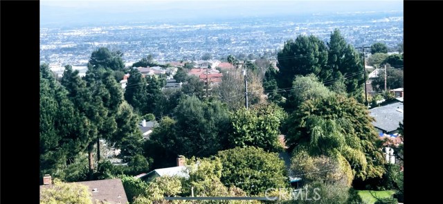 Panoramic view from upper lever beyond chain link fence.