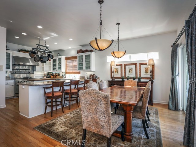 Gorgeous dining area looks out to the ocean and into the open chef style kitchen with breakfast bar.