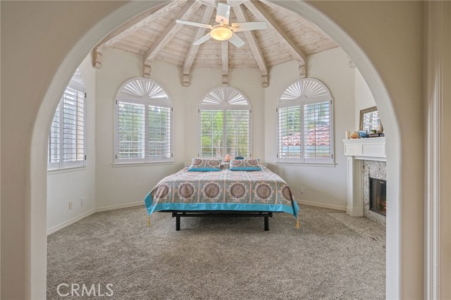 Master suite with beautiful beamed ceiling and fireplace
