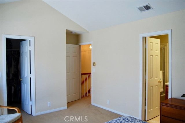 Master Suite 1 with walk in closet, full bathroom, and outside deck