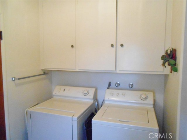 Utility Room with Washer and Dyer Hook-ups. Look at those Extra Large Cabinets as well...Plenty of Room for Storing/Hiding all kinds of Items.