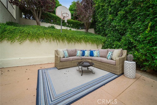 Side patio with access to front and back yards