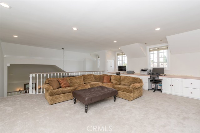 Another upstairs family room view...check out the awesome built in desk/office along the whole wall!  This is perfect for a home office or for homework stations for the kids! The windows look out to the front of the home.