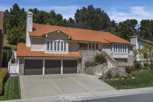 Beautiful curb appeal with a 3 car garage and stonework staircase