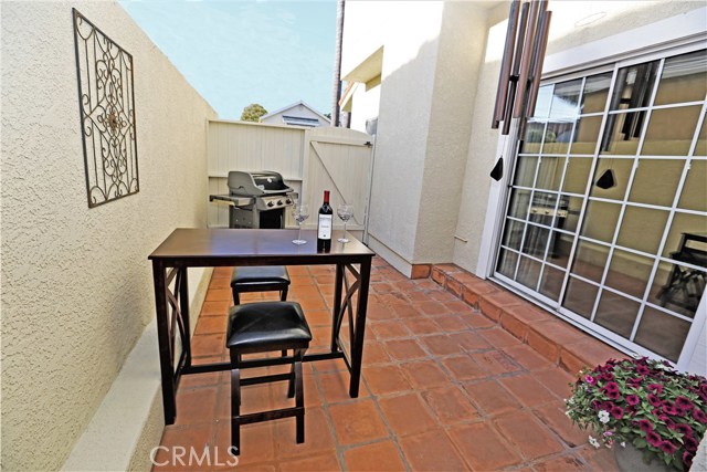 Side patio with saltillo tile.  Great BBQ location!