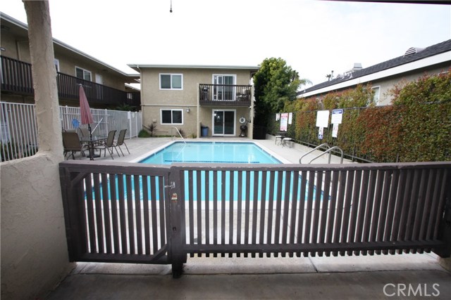 The patio of the condo - gate leads out to the pool