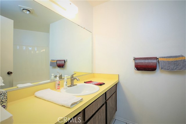 The Second Full Bath is Well Sized with a Large Vanity and a Tub Shower. This Full Bath is adjacent to the Second Bedroom and also serves as the Guest Bathroom. The Bathroom can be Easily Remodeled and Modernized.