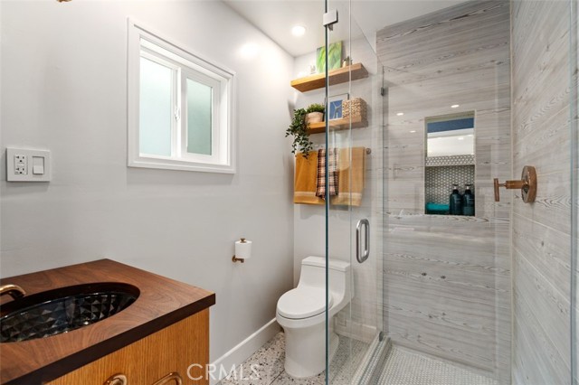 3/4 bath features custom walnut vanity