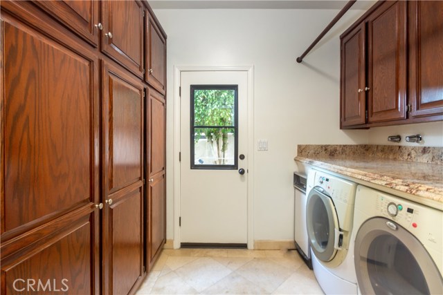 Laundry room located between the direct access to 3 car garage and kitchen