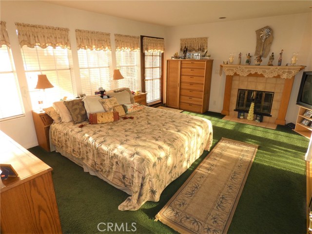 Large master suite with attached master bath, ocean view,deck & wood burning fireplace with gas starter..