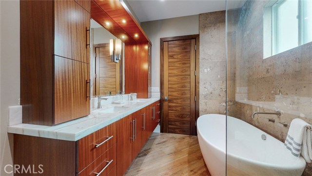 Beautiful Main Floor Master Bathroom, with MTI Stone Soaking Tub and Walk In Shower. Natural Quartz counter top