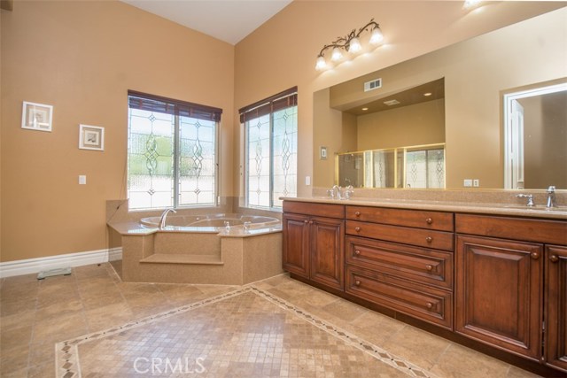 Master Bath with Dual Sinks and Large Jacuzzi Tub.