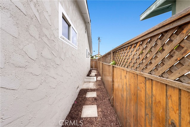 Fenced Side Yard with Crawlspace Access