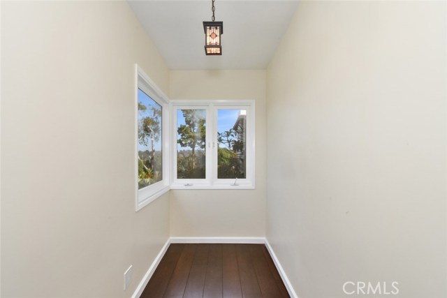 Alcove off master bedroom has great views out of new windows and just the right size for a small desk or chaise.