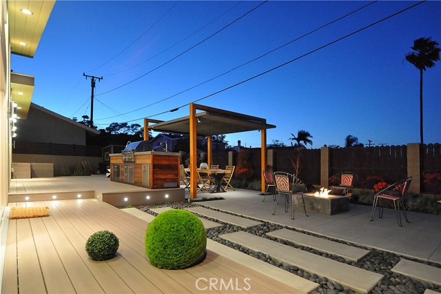 Firepit, built-in BBQ island and a custom made pergola