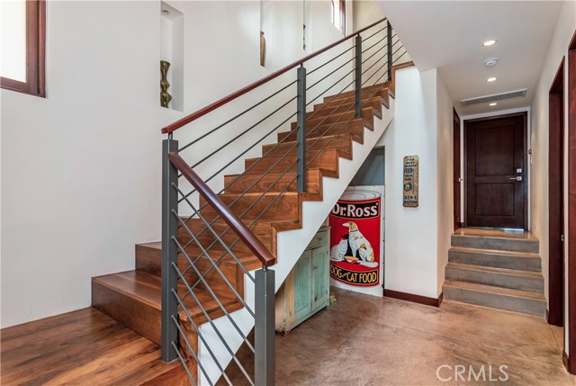 Custom walnut Stairway leading to the second floor